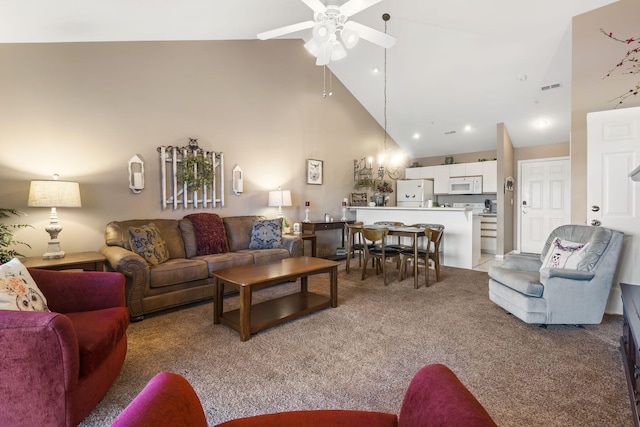 carpeted living room with high vaulted ceiling and ceiling fan