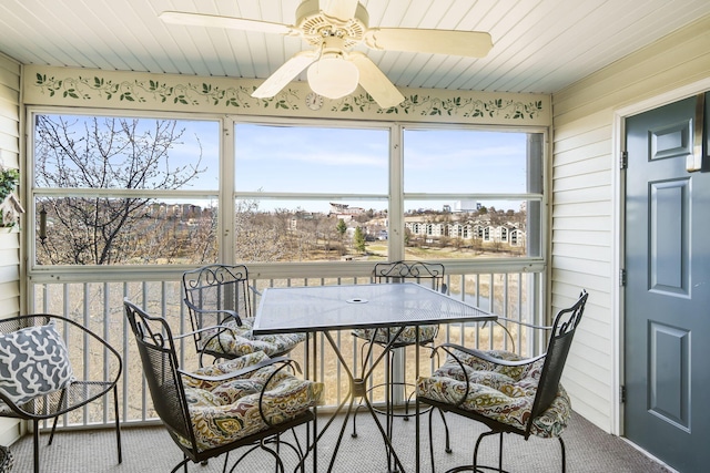 sunroom featuring wooden ceiling and ceiling fan