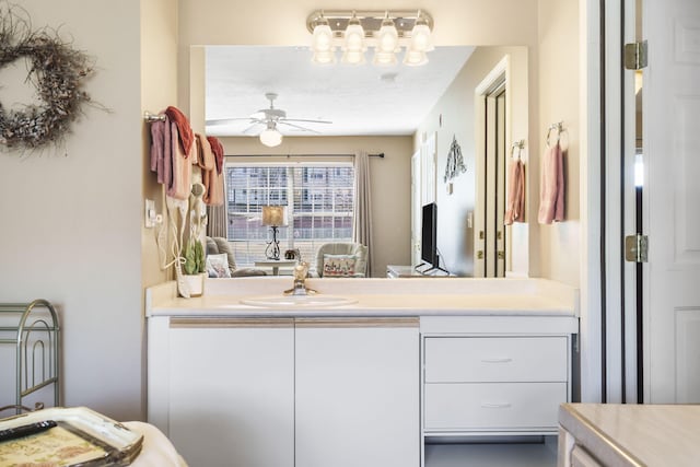 bathroom with ceiling fan and vanity