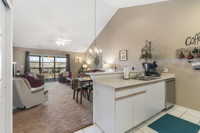 kitchen featuring light carpet, sink, dishwasher, high vaulted ceiling, and white cabinetry