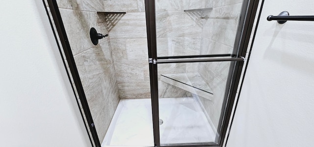 interior space featuring tiled shower