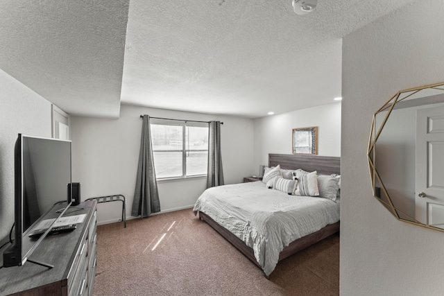 bedroom featuring carpet floors and a textured ceiling