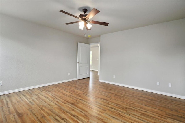 empty room with ceiling fan and light wood-type flooring