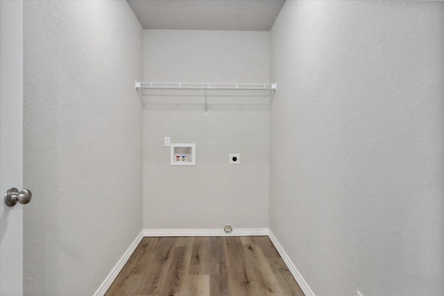 laundry area with washer hookup, hookup for an electric dryer, and wood-type flooring