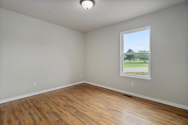 spare room featuring light hardwood / wood-style floors