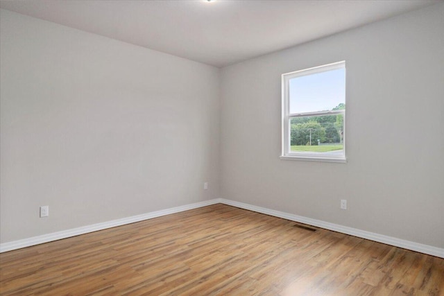 unfurnished room featuring light wood-type flooring