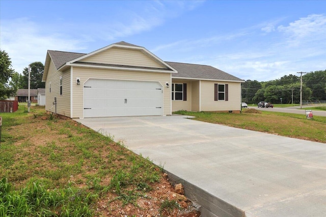 view of front facade with a front yard and a garage