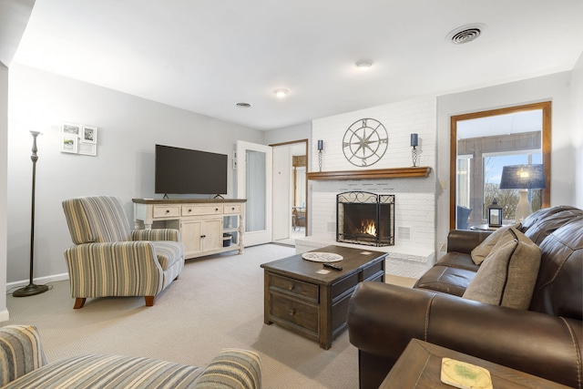 living room featuring a fireplace and light carpet