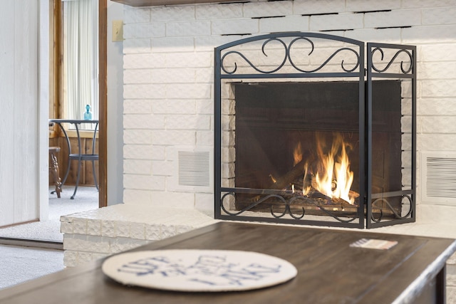 3 Port Holiday Dr Unit G, Kimberling City, MO 65686 - interior details with visible vents and a fireplace