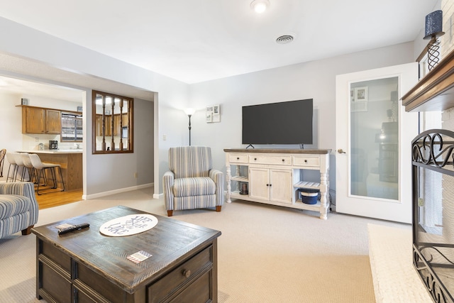 3 Port Holiday Dr Unit G, Kimberling City, MO 65686 - living area featuring baseboards, visible vents, and light carpet