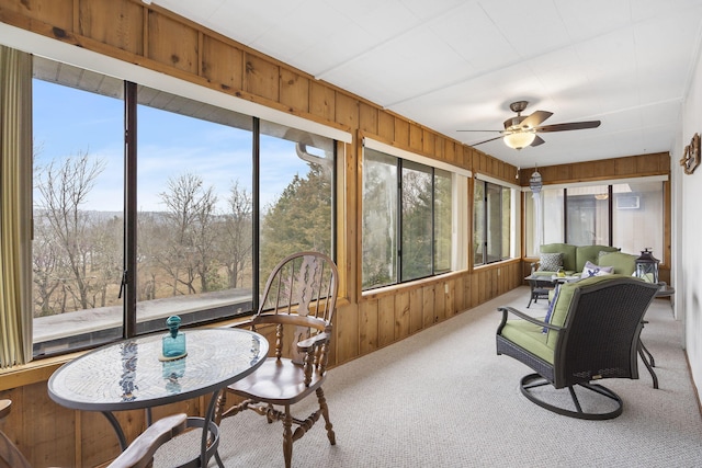 sunroom featuring ceiling fan