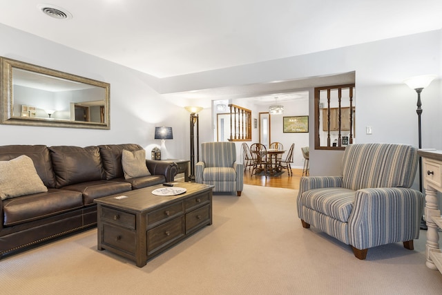 living room featuring light carpet