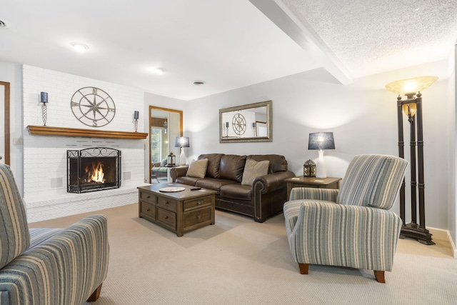 carpeted living room featuring a brick fireplace and a textured ceiling