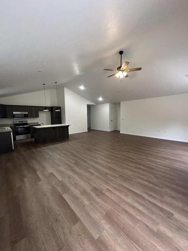 living room featuring ceiling fan, dark hardwood / wood-style flooring, and vaulted ceiling