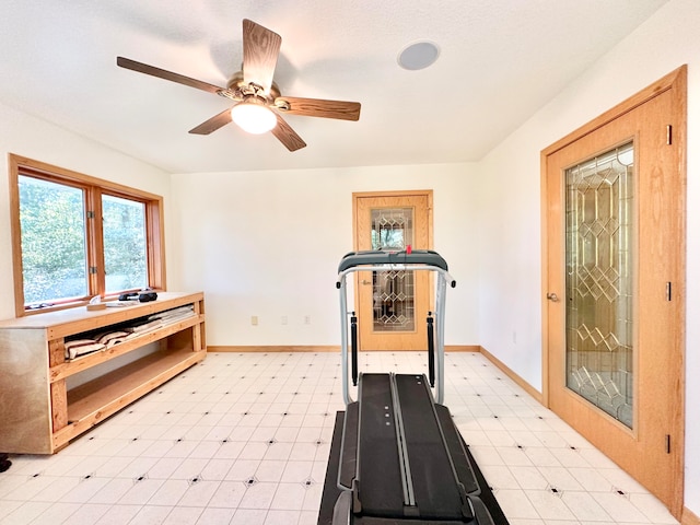 workout area featuring ceiling fan