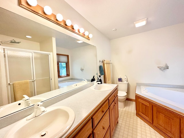 full bathroom with vanity, toilet, and independent shower and bath