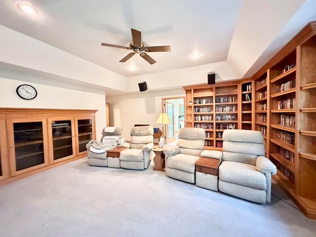 interior space with carpet flooring and ceiling fan