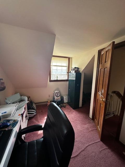 office area featuring lofted ceiling and carpet