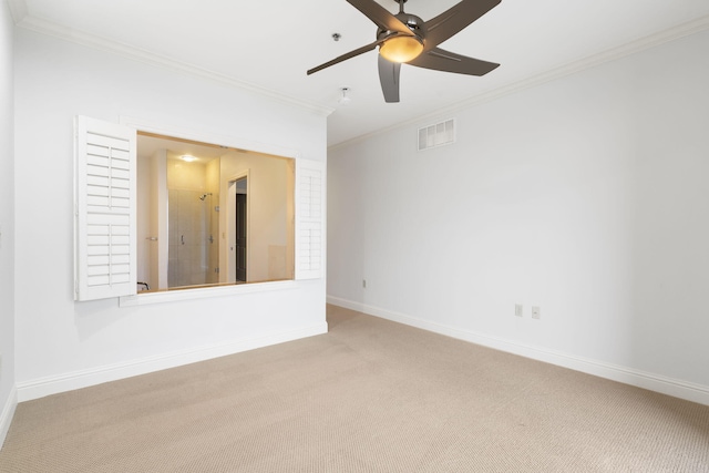 unfurnished room featuring crown molding, carpet flooring, and ceiling fan