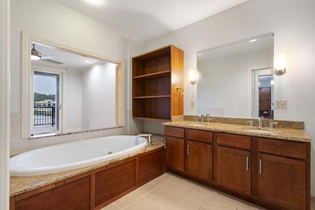 bathroom featuring ceiling fan, vanity, tile patterned flooring, and a tub