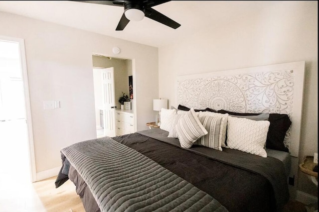 bedroom with light wood-type flooring and ceiling fan
