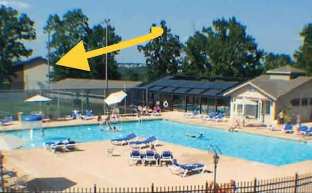 community pool featuring fence