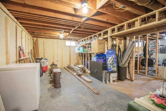 basement featuring refrigerator