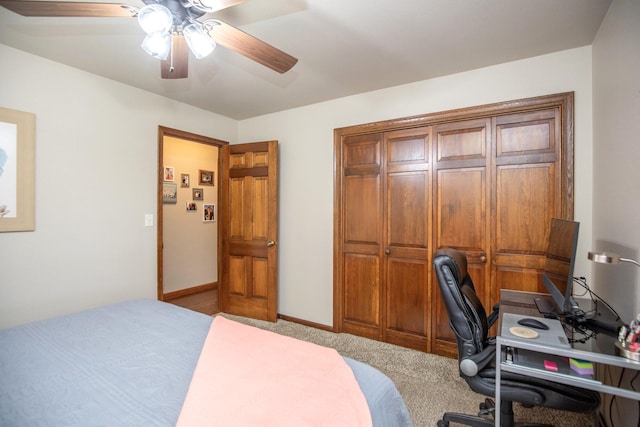 carpeted bedroom with a closet and ceiling fan