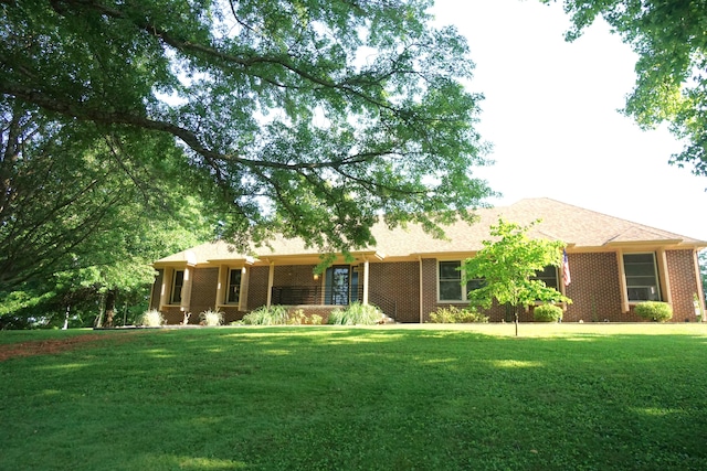 ranch-style house with a front yard