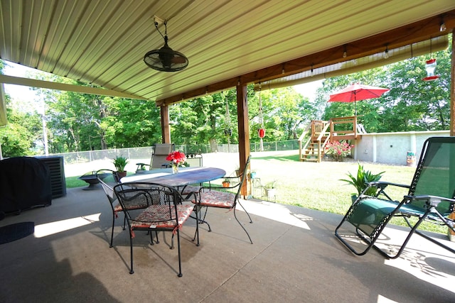 view of patio with ceiling fan and grilling area