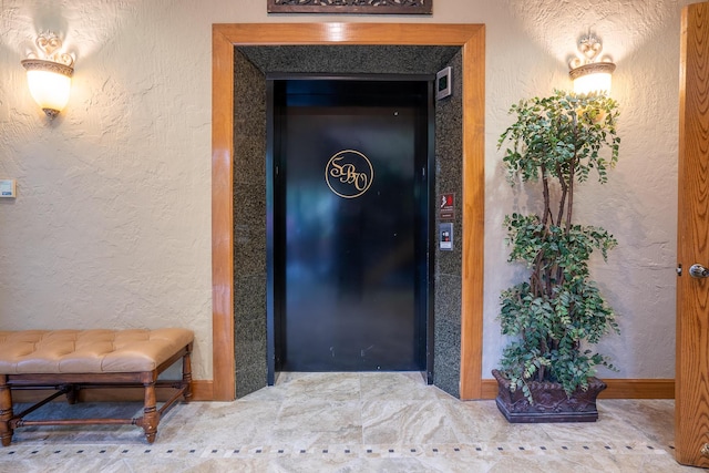 653 Forest Lake Dr, Branson West, MO 65737 - elevator featuring a textured wall