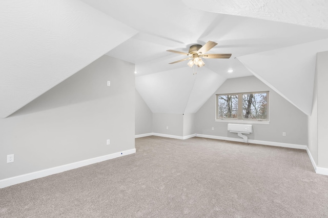 additional living space with carpet floors, vaulted ceiling, and ceiling fan