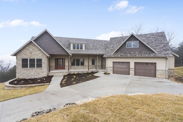 craftsman-style home with a garage and a front yard