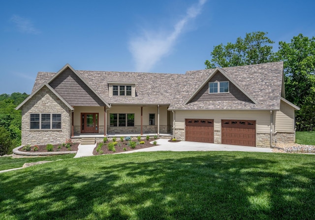 653 Forest Lake Dr, Branson West, MO 65737 - craftsman-style home with stone siding, an attached garage, and a front yard