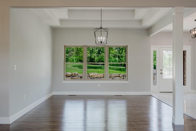 653 Forest Lake Dr, Branson West, MO 65737 - unfurnished dining area with a chandelier, healthy amount of natural light, wood finished floors, and a raised ceiling