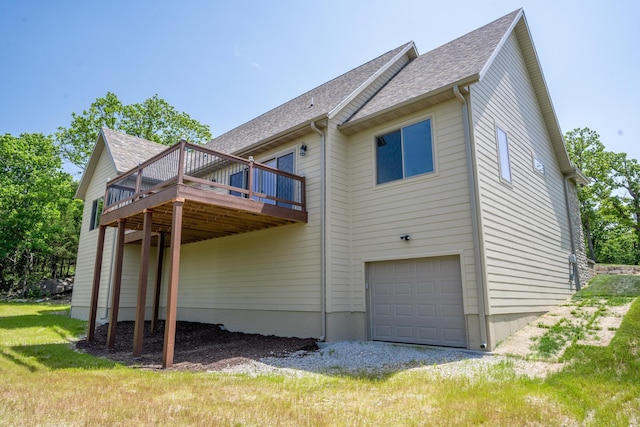 653 Forest Lake Dr, Branson West, MO 65737 - rear view of property featuring an attached garage, a deck, and a shingled roof