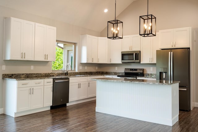 653 Forest Lake Dr, Branson West, MO 65737 - kitchen featuring stainless steel appliances, white cabinets, a center island, dark wood finished floors, and dark stone counters