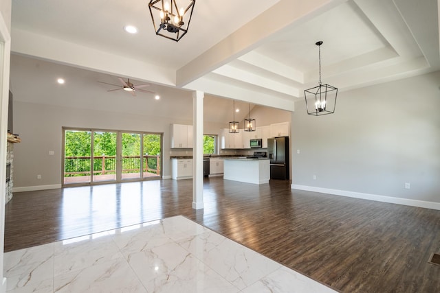 653 Forest Lake Dr, Branson West, MO 65737 - unfurnished living room featuring a chandelier, baseboards, a ceiling fan, recessed lighting, and dark wood-style floors