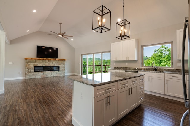 653 Forest Lake Dr, Branson West, MO 65737 - kitchen with white cabinets, a sink, dark wood finished floors, recessed lighting, and high vaulted ceiling