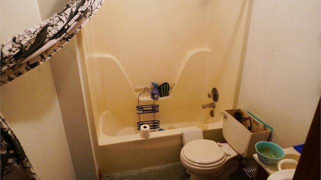 bathroom with shower / bath combo with shower curtain and toilet