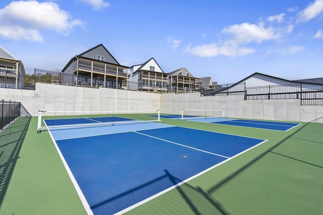 view of sport court with basketball hoop