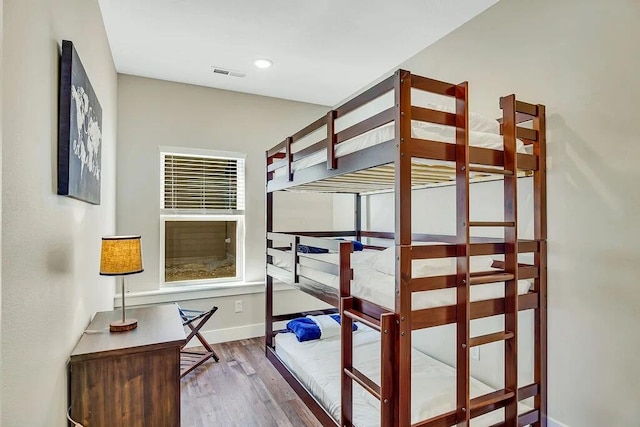 bedroom featuring wood-type flooring