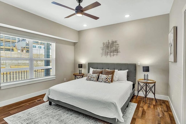 bedroom with hardwood / wood-style flooring and ceiling fan