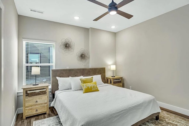 bedroom featuring ceiling fan and dark hardwood / wood-style flooring