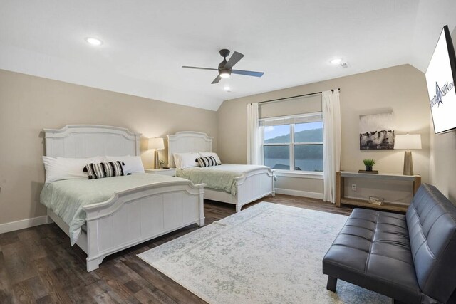 bedroom with lofted ceiling, dark wood-type flooring, and ceiling fan