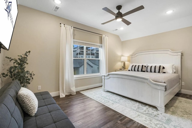 bedroom featuring ceiling fan, lofted ceiling, and dark hardwood / wood-style floors