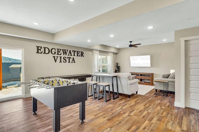 game room featuring ceiling fan and light hardwood / wood-style floors