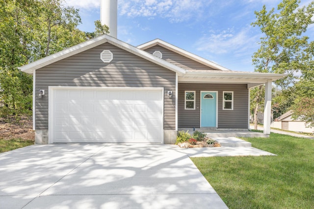 view of front of property featuring a garage and a front yard