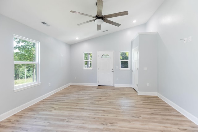 unfurnished room with ceiling fan, light wood-type flooring, and vaulted ceiling