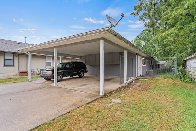 view of vehicle parking featuring a carport and a yard